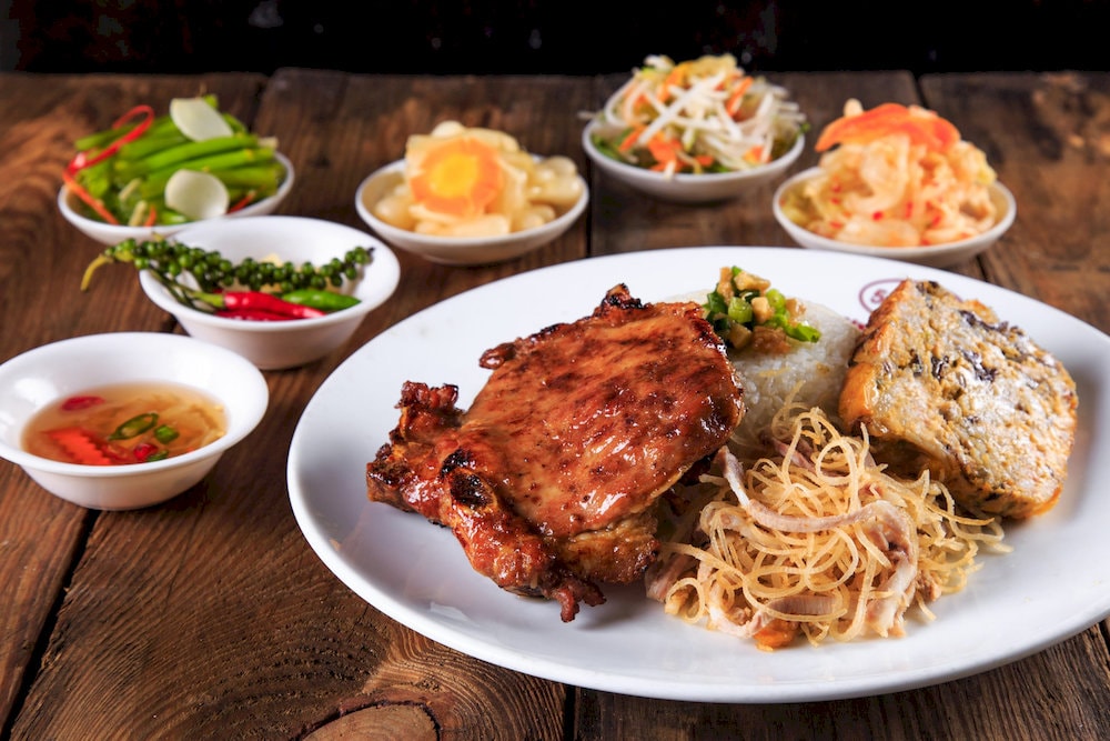 The plate is generous with soft, fragrant rice and a variety of sides that reflect authentic Vietnamese flavors